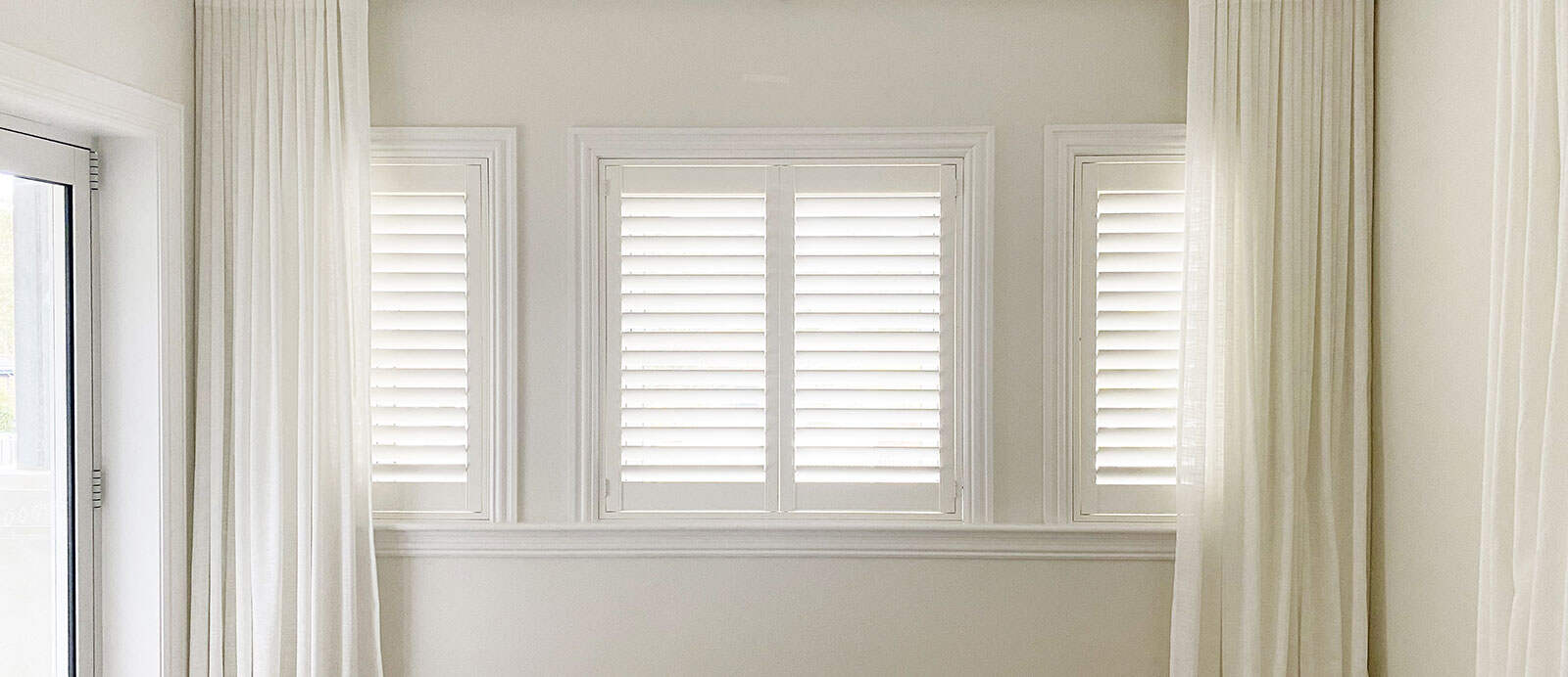 plantation shutters with sheer curtains