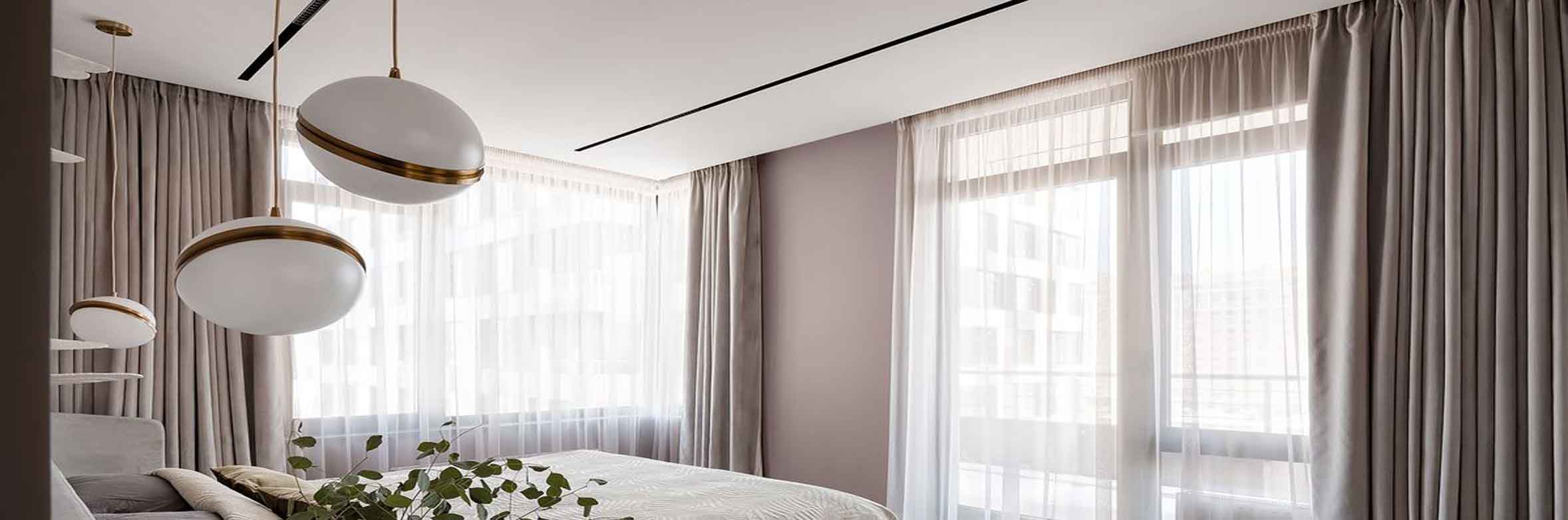 sheers paired with blockout curtains in bedroom